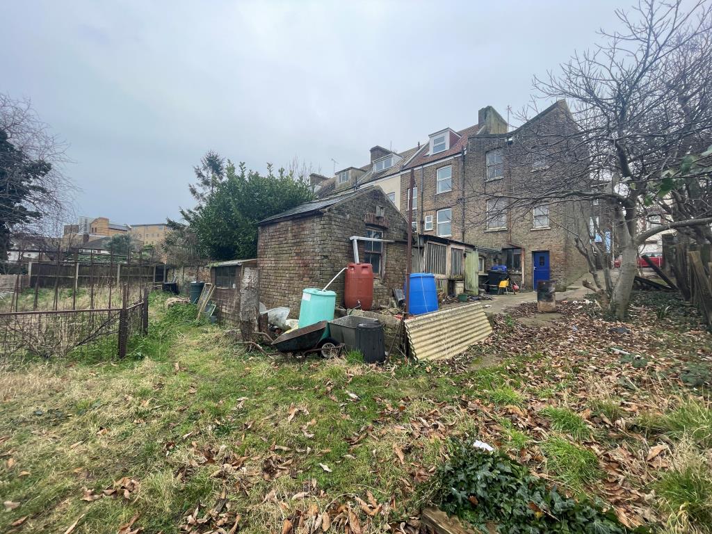 Lot: 134 - END-TERRACE HOUSE FOR REFURBISHMENT - Rear view of end-terrace house
